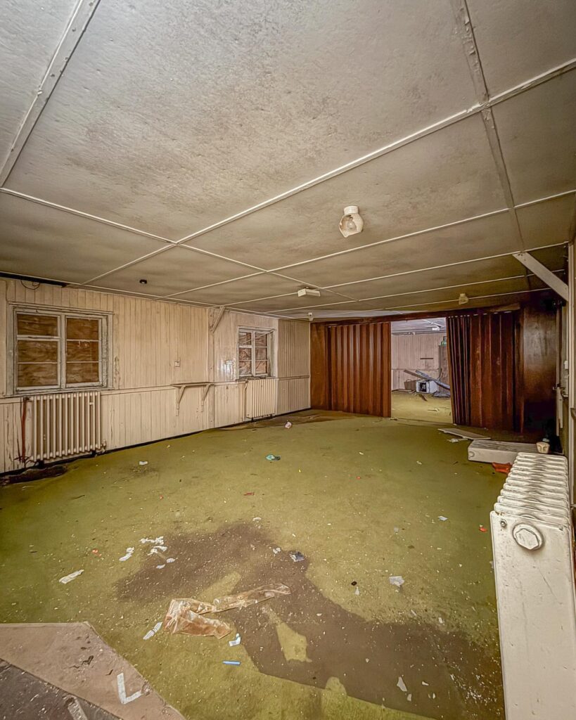 British explorer Chloe Urbex uncovers “super creepy” abandoned MOD barracks in London left to rot for 50 years - eerie photos reveal peeling walls, decayed halls and old signs.