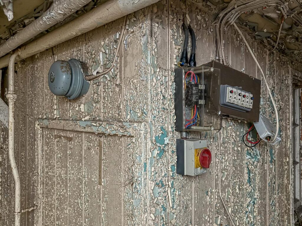British explorer Chloe Urbex uncovers “super creepy” abandoned MOD barracks in London left to rot for 50 years - eerie photos reveal peeling walls, decayed halls and old signs.