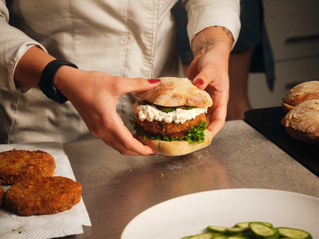 Michelin star chef creates cat food burger with KatKin to show pets deserve quality meals too - served in ciabatta with gourmet toppings and praised as delicious.