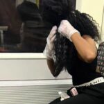 Woman shocks commuters by dyeing her hair on London Underground as baffled passenger films viral TikTok with 3.3m views showing brazen beauty routine on the Tube.