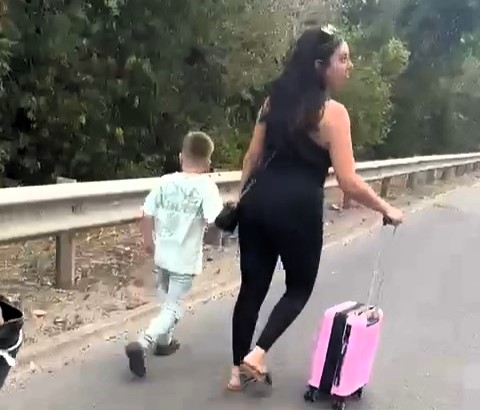 Dean and Gina Louca abandoned their taxi in a three mile M1 tailback and walked the hard shoulder to Luton Airport before a kind driver helped them catch their Greece flight.