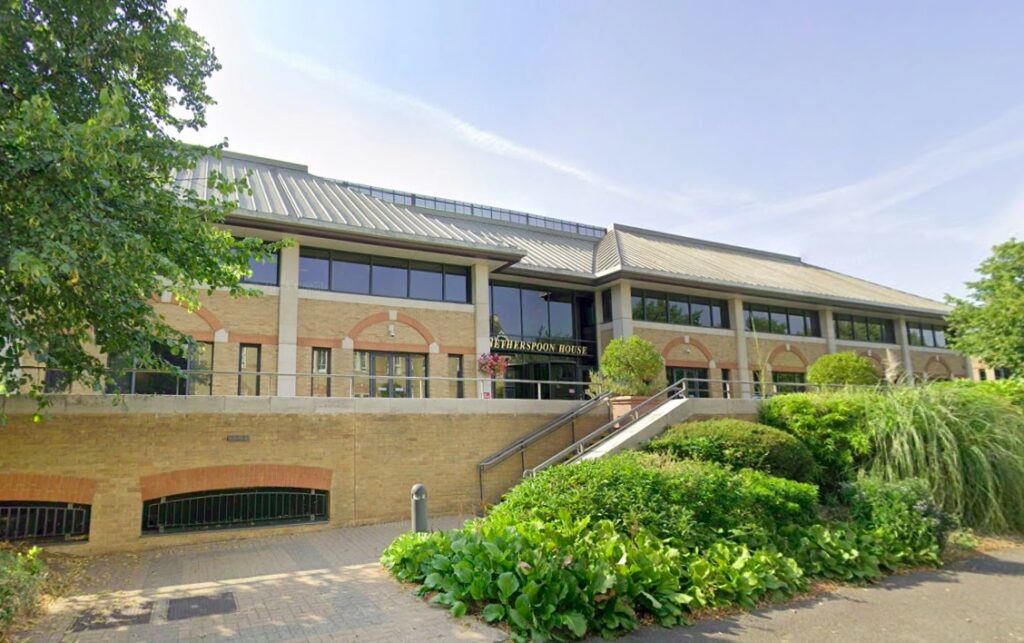 Four men were caught on camera accidentally trying to enter Wetherspoons’ head office in Watford thinking it was a pub, leaving locals and millions online in stitches.