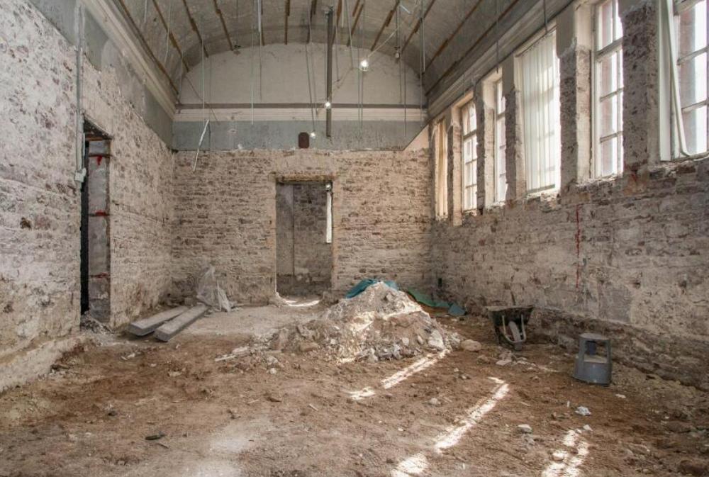 Former Victorian police station in Maryport on sale for £180,000 - empty red sandstone building with cell entrances has planning permission for seven flats and homes.