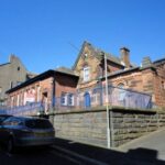 Former Victorian police station in Maryport on sale for £180,000 - empty red sandstone building with cell entrances has planning permission for seven flats and homes.