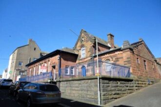 Former Victorian police station in Maryport on sale for £180,000 - empty red sandstone building with cell entrances has planning permission for seven flats and homes.