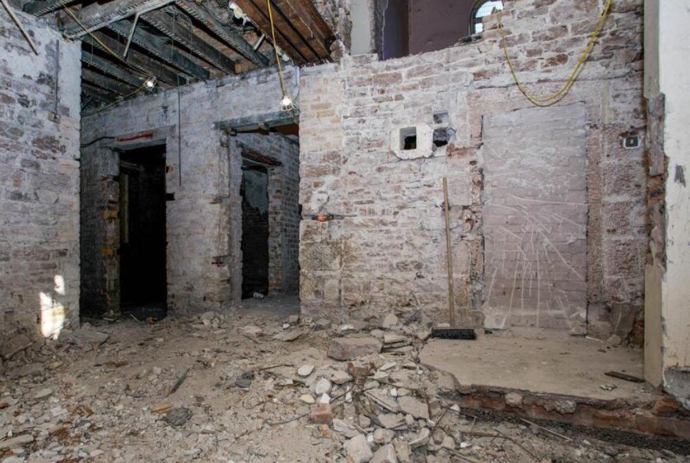 Former Victorian police station in Maryport on sale for £180,000 - empty red sandstone building with cell entrances has planning permission for seven flats and homes.