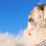 Huge chalk cliff collapses in Normandy sending tonnes of rock crashing onto beach - dramatic landslide near Petites Dalles shocks locals but miraculously no injuries.