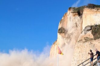 Huge chalk cliff collapses in Normandy sending tonnes of rock crashing onto beach - dramatic landslide near Petites Dalles shocks locals but miraculously no injuries.