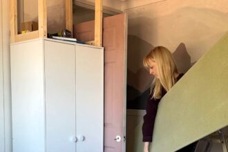 A mum has created bespoke built-in wardrobes for her son using flatpack Argos furniture, saving over £2,300. The project involved basic tools, MDF panels, and a creative design, totaling just £912.33.