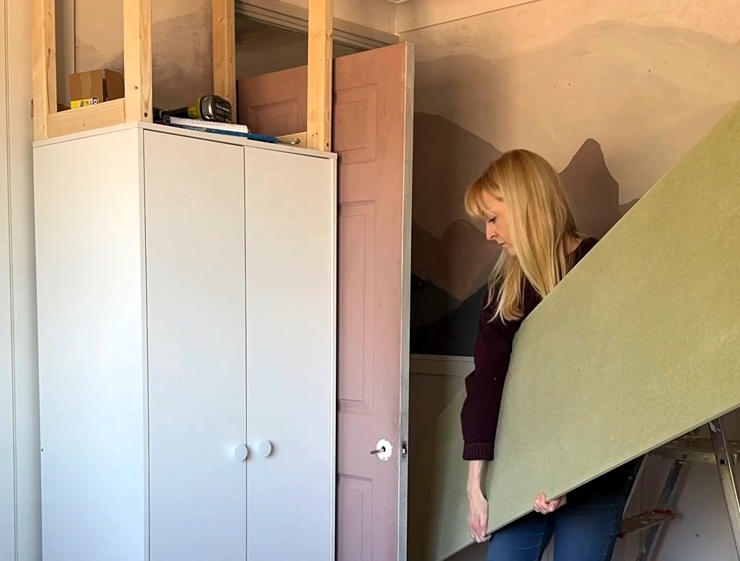 A mum has created bespoke built-in wardrobes for her son using flatpack Argos furniture, saving over £2,300. The project involved basic tools, MDF panels, and a creative design, totaling just £912.33.