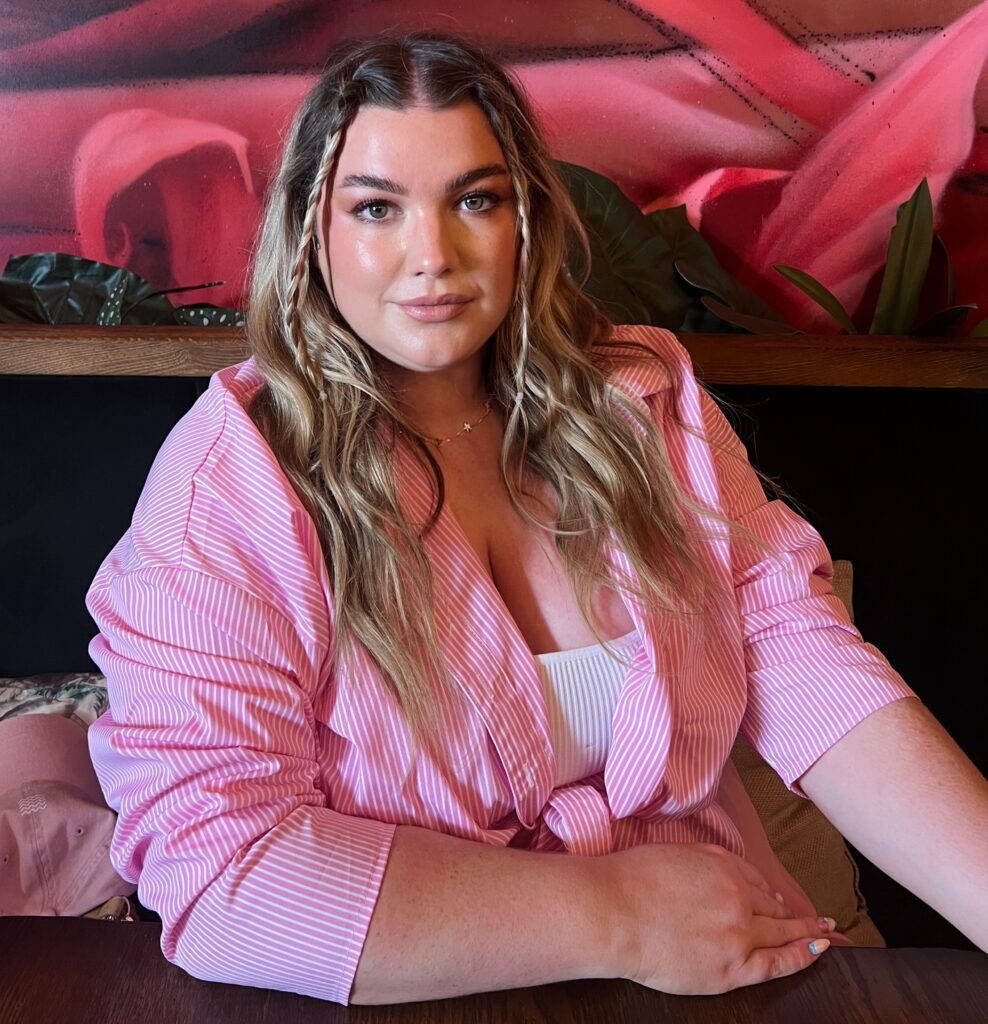 Passengers rallied to help a woman avoid a £75 Ryanair cabin bag fee by strapping it with belts, but staff refused to budge and made her pay before allowing her to board.