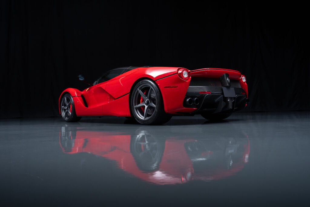A 2015 Ferrari LaFerrari in Rosso Corsa with just 54 miles and over £127k in options is for sale in Monterey for £3.5m offered in pristine time capsule condition.