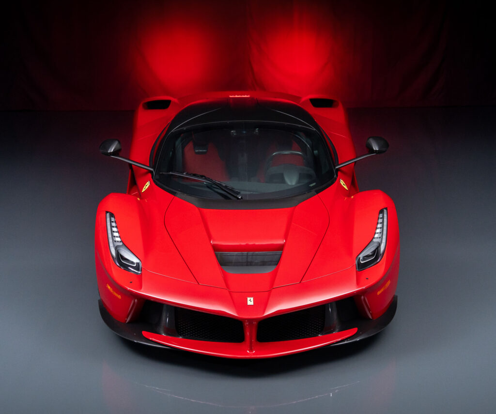 A 2015 Ferrari LaFerrari in Rosso Corsa with just 54 miles and over £127k in options is for sale in Monterey for £3.5m offered in pristine time capsule condition.