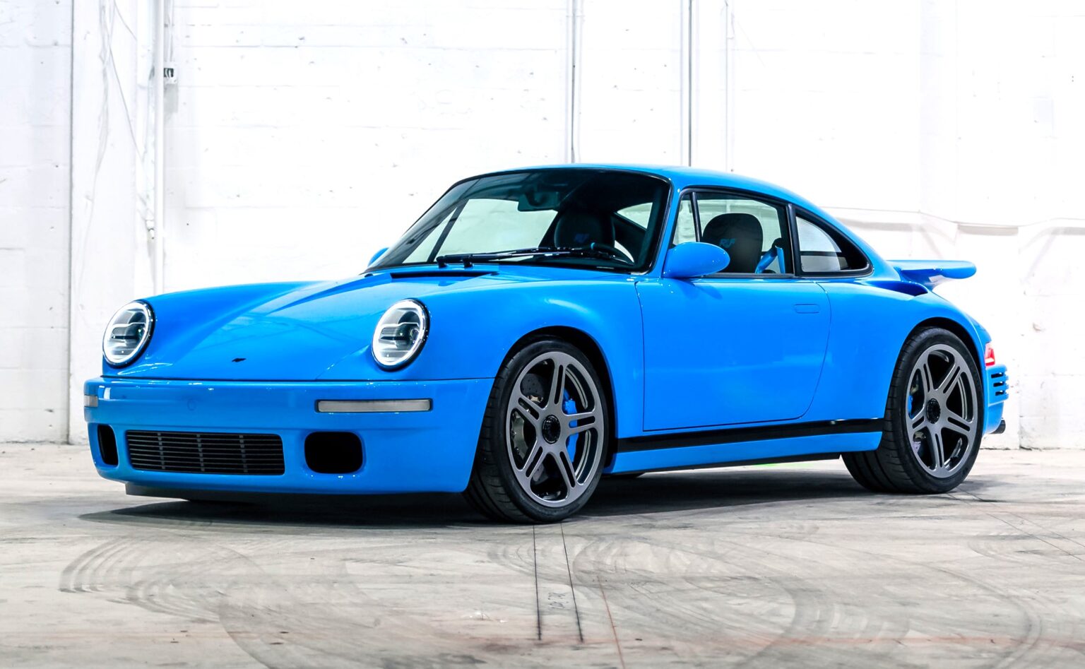 A rare 2021 RUF CTR Anniversary based on the Porsche 911 with 710bhp 224mph top speed and unique Riviera Blue spec is for sale in Monterey for £2.5m with only 200 miles.