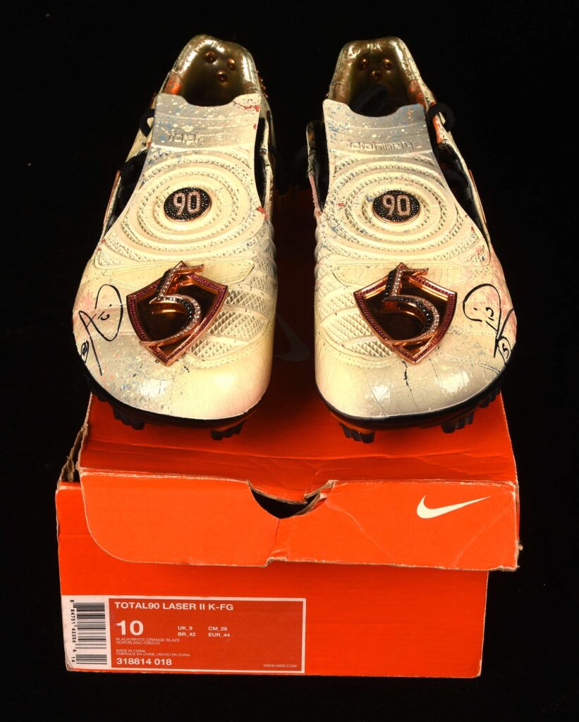 Rio Ferdinand’s diamond encrusted, gold coated Nike boots have sold for £23,400 at auction. Signed and custom designed, they’re among the world’s most unique boots.