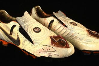 Rio Ferdinand’s diamond encrusted, gold coated Nike boots have sold for £23,400 at auction. Signed and custom designed, they’re among the world’s most unique boots.