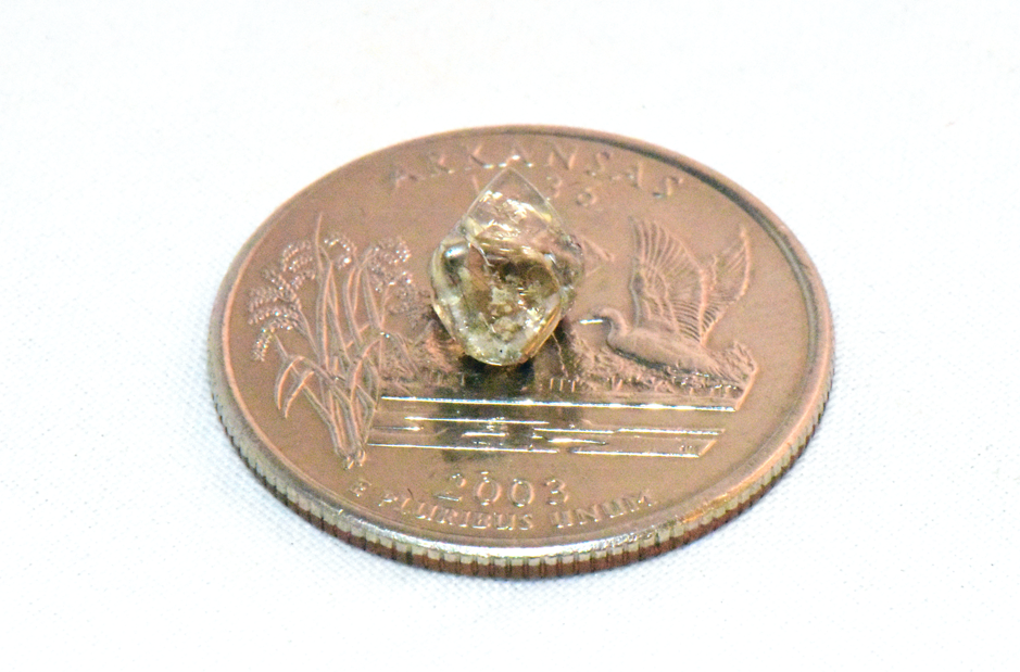 After weeks of searching at Arkansas’ Crater of Diamonds, a woman found a rare 2.3 carat gem on her last day, now destined to become her unique engagement ring.