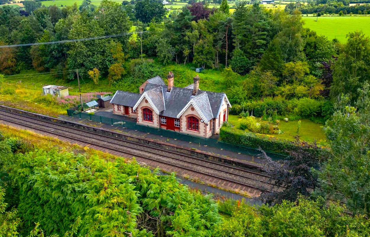 Victorian railway station home in Little Salkeld on market for £375,000 with original features, three bedrooms, gardens and paddock offering unique historic charm.