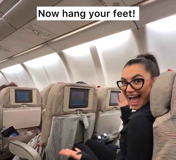 Travel expert Nicole Lazo shares 5 top comfort hacks for flying, from makeshift phone holders to foot hammocks, sparking debate with one controversial tip for better sleep.