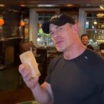 WWE legend John Cena stunned Dublin fans by pulling pints and downing a Guinness in one go during his farewell tour stop, delighting locals at J.R. Mahon’s pub.