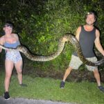 A 4’11” python hunter won £7,383 after capturing 60 snakes in Florida’s annual challenge, setting a record year and becoming the first female ultimate grand prize winner.