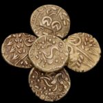 Amateur metal detectorist unearths Iron Age gold hoard in Derbyshire - five Celtic coins dating back 2,000 years sell for £6,500 at auction after rare Corieltauvi find.