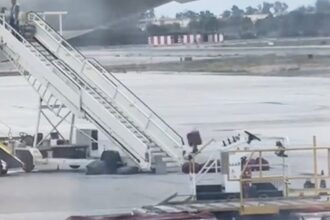 Baggage handler filmed hurling items like an Olympian at Madrid Airport sparks debate - some slam treatment of luggage while others defend it as efficient cabin work.