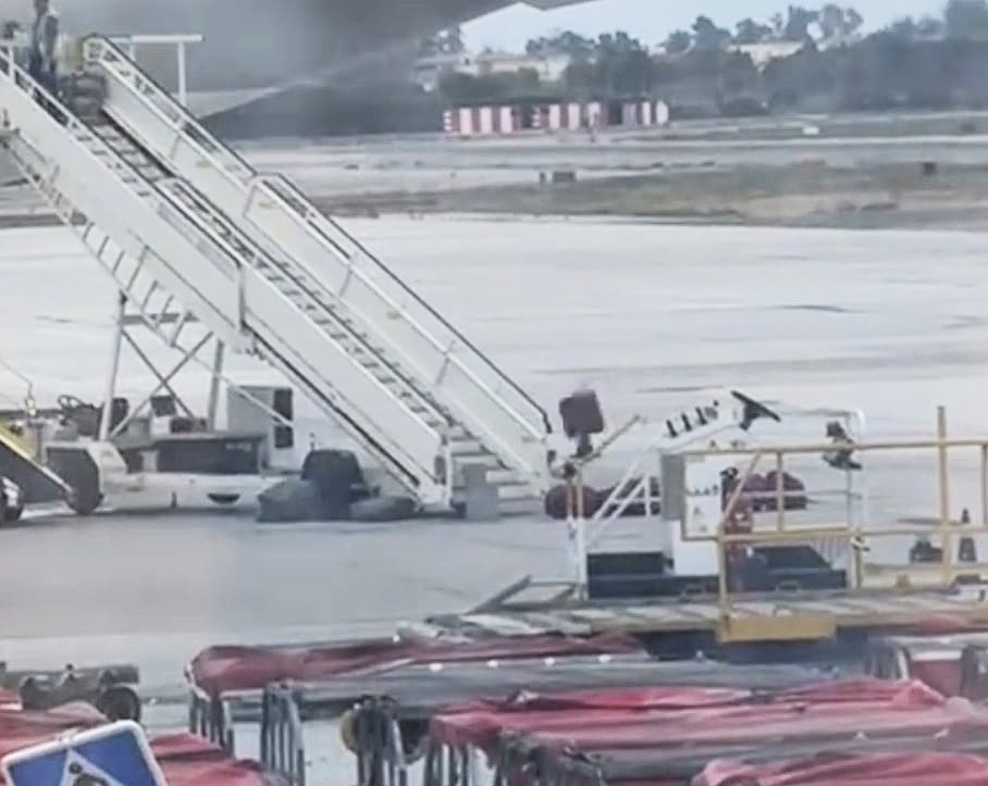 Baggage handler filmed hurling items like an Olympian at Madrid Airport sparks debate - some slam treatment of luggage while others defend it as efficient cabin work.