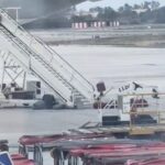 Baggage handler filmed hurling items like an Olympian at Madrid Airport sparks debate - some slam treatment of luggage while others defend it as efficient cabin work.