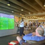 Arsenal fans on a Carnival Cruise were left furious when staff cut off their match against Man City for an NFL game, forcing them to catch the equaliser on a tiny TV.