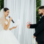 A couple’s wedding vows turned magical when a butterfly landed on the bride before perching on their hands and heads with guests calling it a heavenly blessing from loved ones.