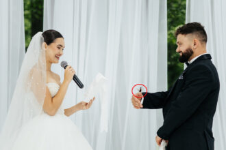 A couple’s wedding vows turned magical when a butterfly landed on the bride before perching on their hands and heads with guests calling it a heavenly blessing from loved ones.
