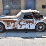 A 1959 Jaguar XK150 barn find is up for sale at £20,000 needing full restoration with matching numbers and rare factory automatic making it a classic car bargain.