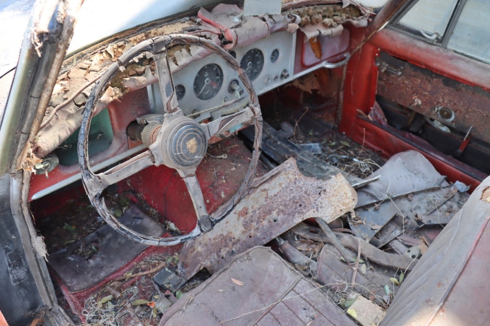 A 1959 Jaguar XK150 barn find is up for sale at £20,000 needing full restoration with matching numbers and rare factory automatic making it a classic car bargain.