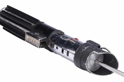 Darth Vader’s original lightsaber from The Empire Strikes Back and Return of the Jedi has sold for £2.7m at auction, becoming the most expensive Star Wars prop ever.