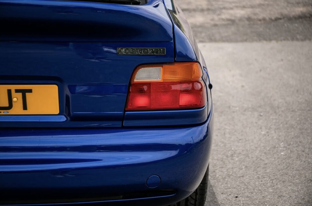 A rare 1996 Ford Escort RS Cosworth Lux with just 22,744 miles sold for £81,563. Iconic whale tail spoiler, 150mph top speed and collector quality make it a gem.