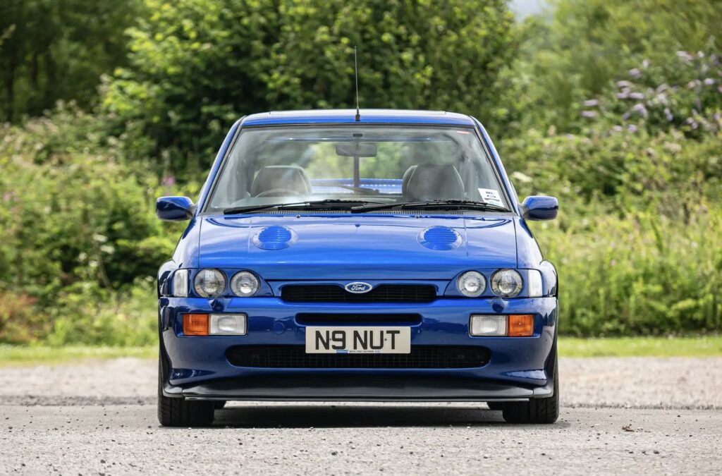 A rare 1996 Ford Escort RS Cosworth Lux with just 22,744 miles sold for £81,563. Iconic whale tail spoiler, 150mph top speed and collector quality make it a gem.