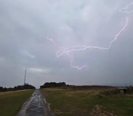 Tristan Northway narrowly avoided disaster when a huge lightning bolt struck just yards from him at Berry Head in Brixham, Devon - capturing the dramatic moment on video.