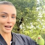 Love Island star Kady McDermott squeals as Hyde Park parakeets swarm her - one cheeky green bird even tries to peck her ear during surprise encounter in London.