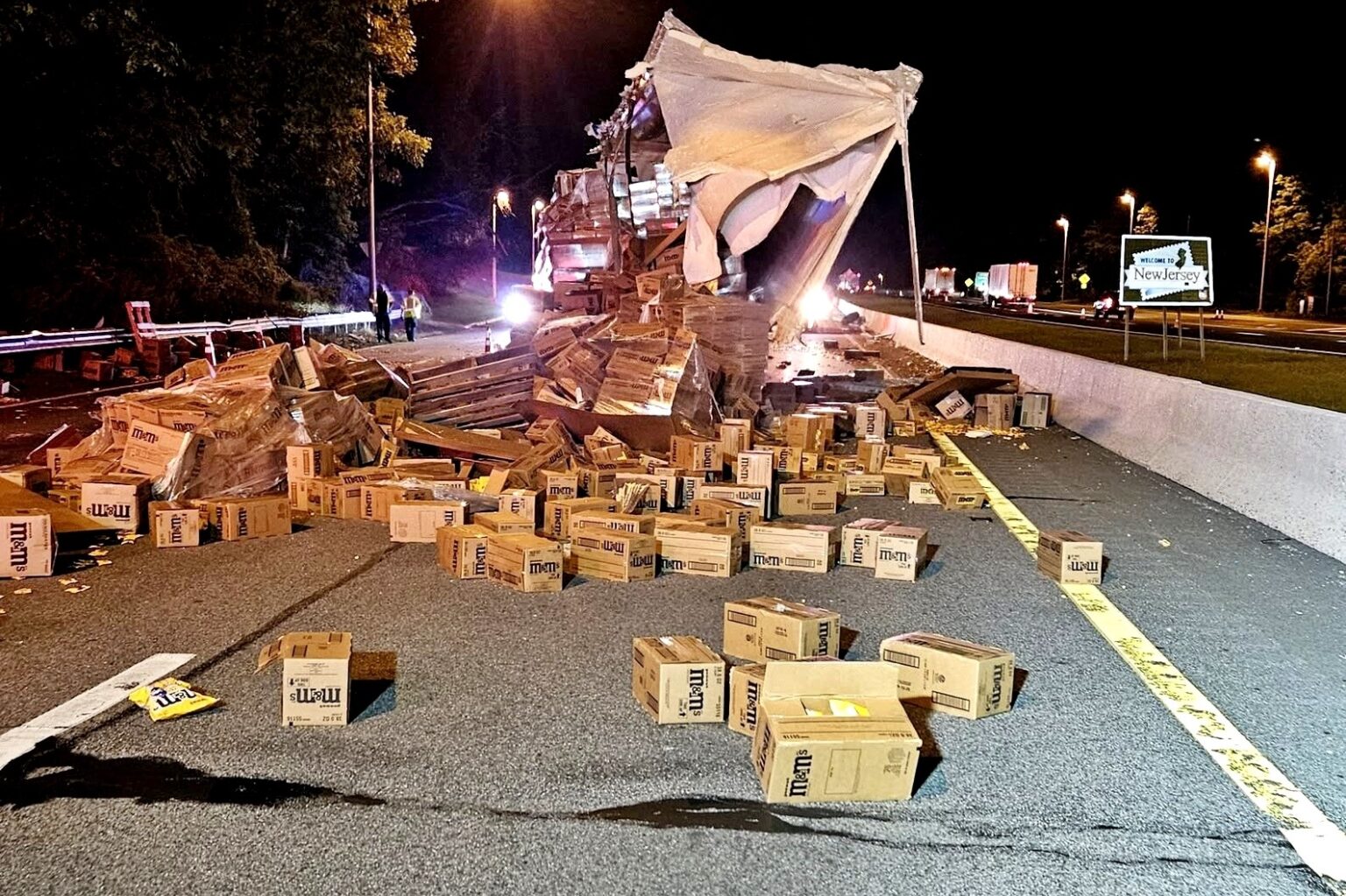 Motorway covered in M\&M’s after lorry crash in New Jersey - Interstate 80 closed as crews cleared sugary mess following collision that spilled chocolate across lanes.