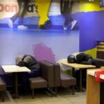 Uber Eats riders spotted asleep in McDonald’s in Fulham - locals divided as some slam trust with food while others sympathise with overworked delivery drivers.