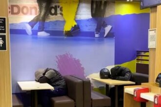 Uber Eats riders spotted asleep in McDonald’s in Fulham - locals divided as some slam trust with food while others sympathise with overworked delivery drivers.