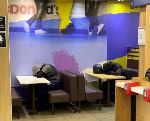 Uber Eats riders spotted asleep in McDonald’s in Fulham - locals divided as some slam trust with food while others sympathise with overworked delivery drivers.