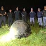 A bizarre hairy cylinder fell from the sky onto a farm in Argentina sparking speculation it could be space junk as baffled officials investigate the mysterious object.