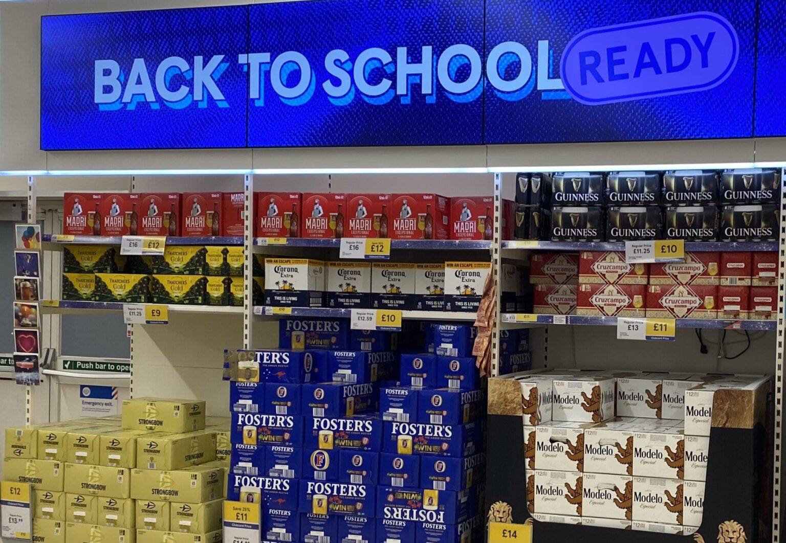 A Tesco in Gillingham amused shoppers after stacking crates of beer under a “Back to school ready” sign, with parents joking it was the perfect end-of-holidays display.