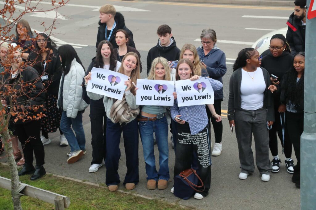 Lewis Capaldi surprises fans by performing his new single on the roof of an Aldi supermarket in Nottingham, leaving shoppers stunned by the unexpected rooftop gig.