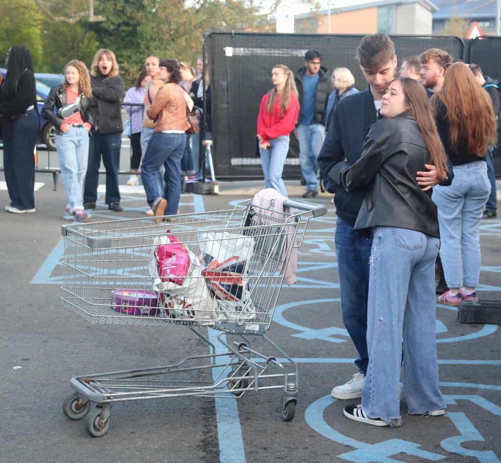 Lewis Capaldi surprises fans by performing his new single on the roof of an Aldi supermarket in Nottingham, leaving shoppers stunned by the unexpected rooftop gig.
