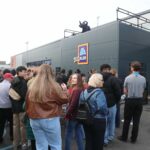 Lewis Capaldi surprises fans by performing his new single on the roof of an Aldi supermarket in Nottingham, leaving shoppers stunned by the unexpected rooftop gig.