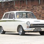 A 1965 Ford Lotus Cortina Mk1 with just 2,561 miles sold for £41,000 at auction, a rare classic restored to outstanding condition and verified by experts.