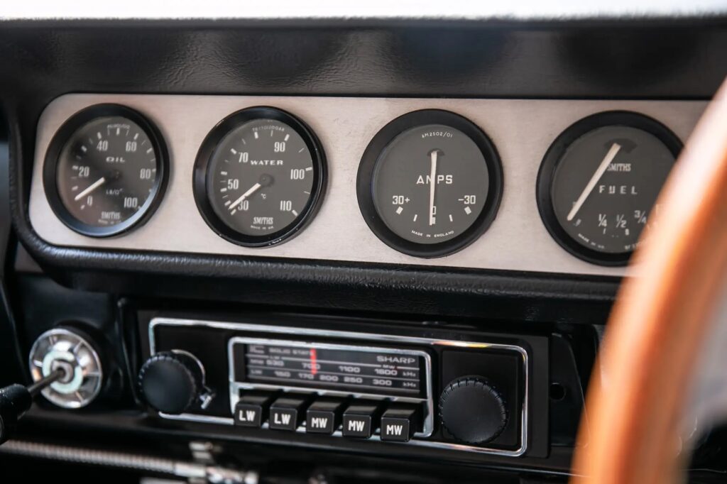 A 1965 Ford Lotus Cortina Mk1 with just 2,561 miles sold for £41,000 at auction, a rare classic restored to outstanding condition and verified by experts.